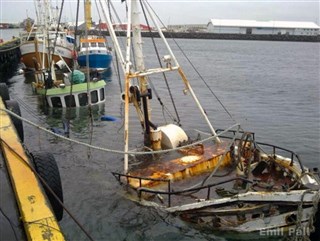 The sunken vessel being lifted from the seabed in 